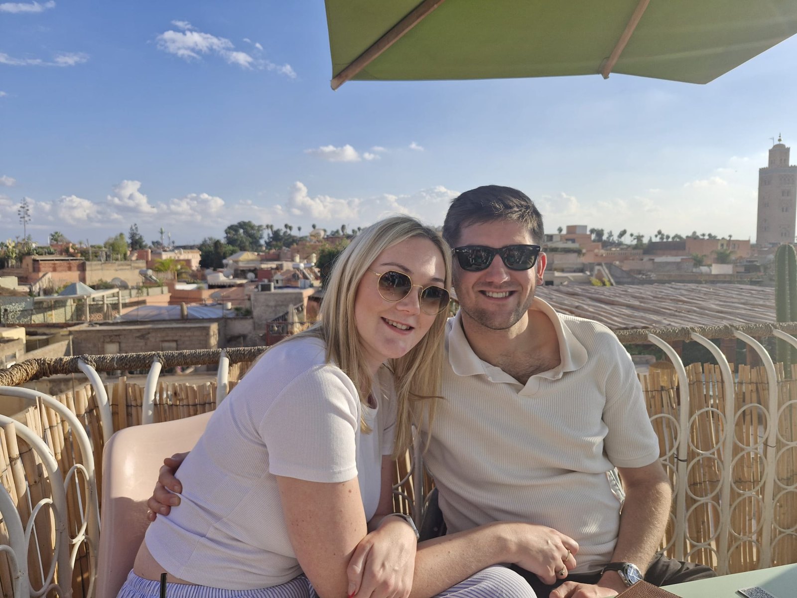 Alex and George together on a sunny rooftop