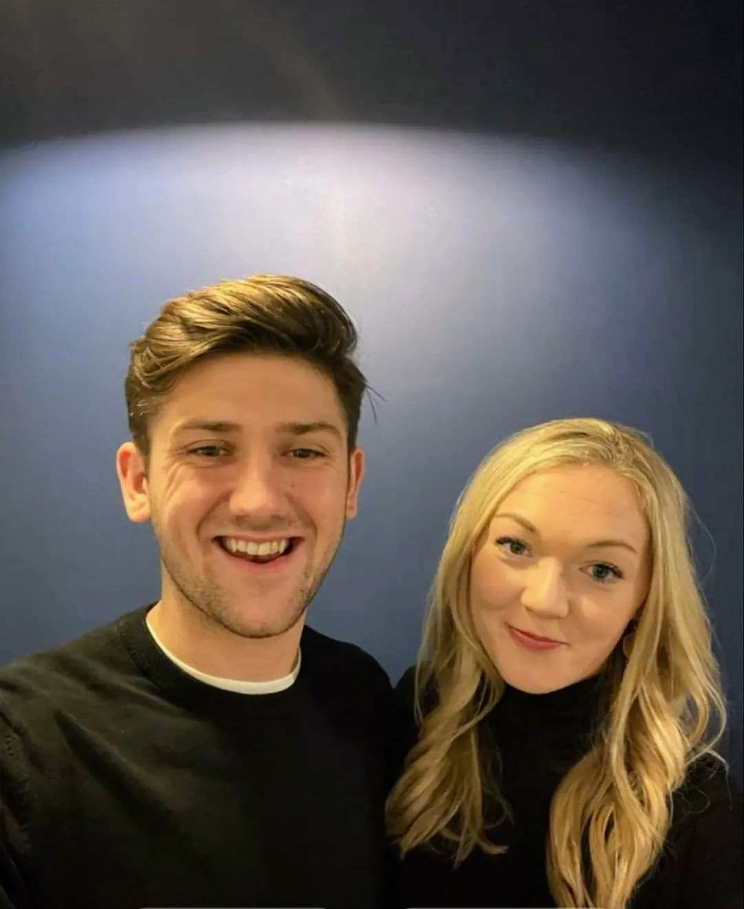 George and Alex smiling together in a selfie